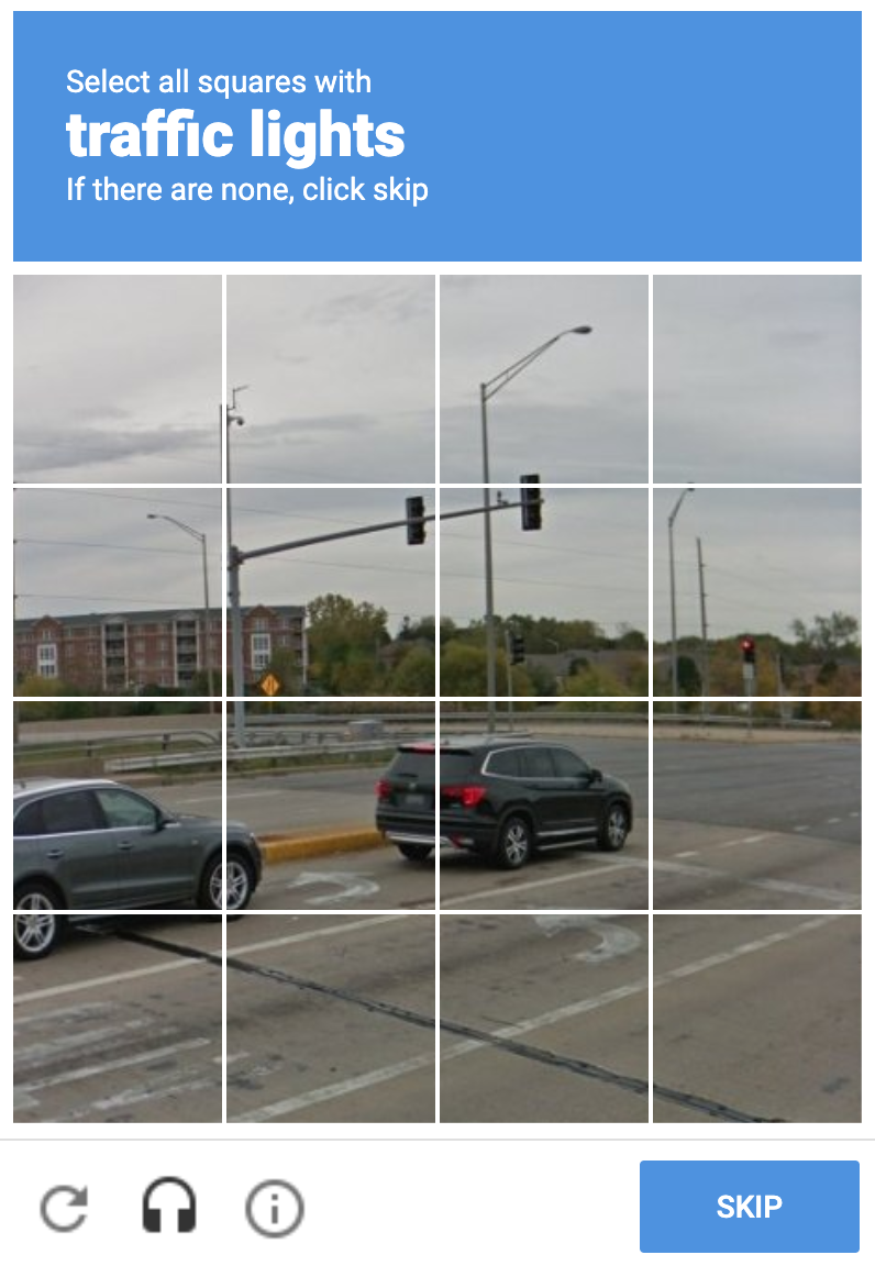 A photo of a crossing divided into a 4x4 grid where the user taking the test is asked to 'Select all squares with traffic lights'.