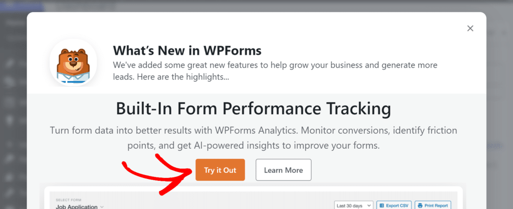 「WPFormsの新機能」というタイトルのポップアップモーダル。クマのアイコンと、「詳細はこちら」の隣に目立つオレンジ色の「試してみる」ボタンがあります。