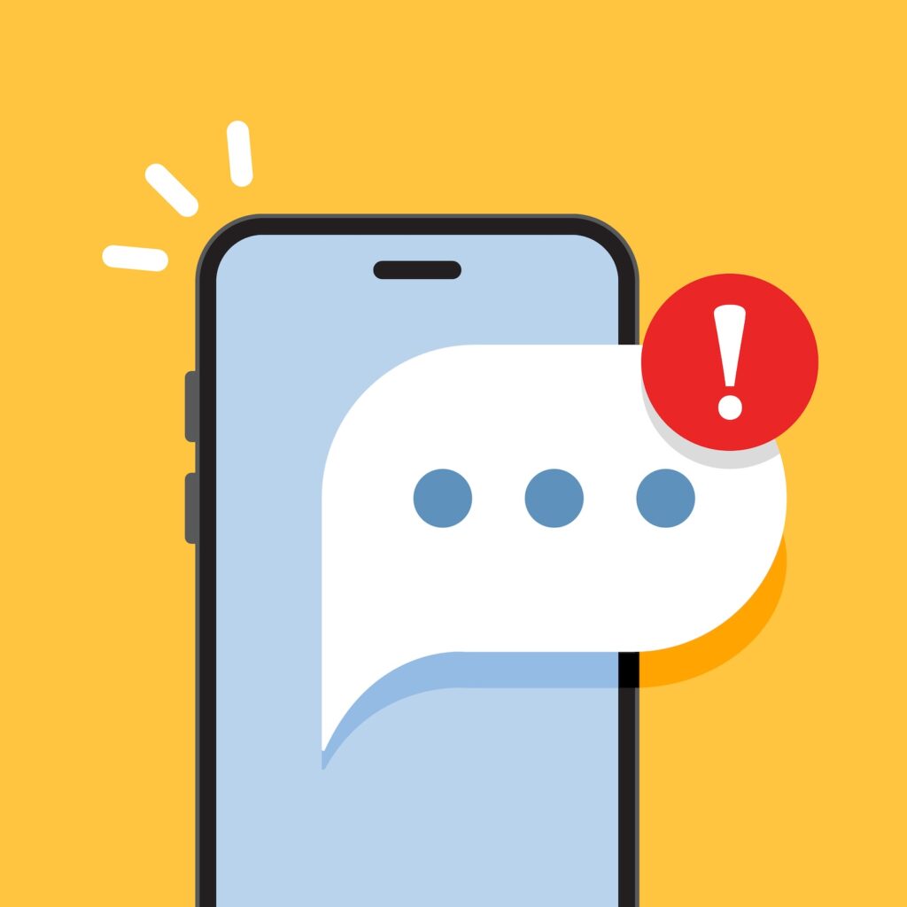 Smartphone with a red warning badge (exclamation) overlapping a white chat bubble on a yellow background represents an alert.