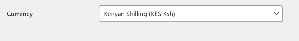 Contrôle déroulant intitulé Devise avec Shilling kényan (KES Ksh) sélectionné. Aborde l'accessibilité en affichant le choix de devise actuel.